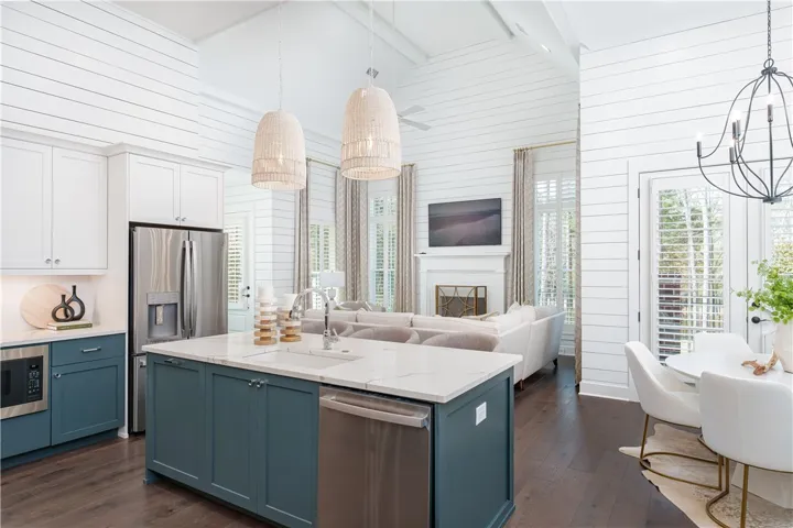 This open concept kitchen and living area offers stylish design and functionality for everyday living. (photo of previous sale)