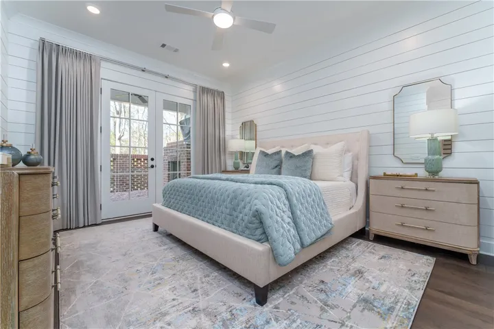 This tranquil bedroom offers direct access to the outdoors, perfect for peaceful mornings.