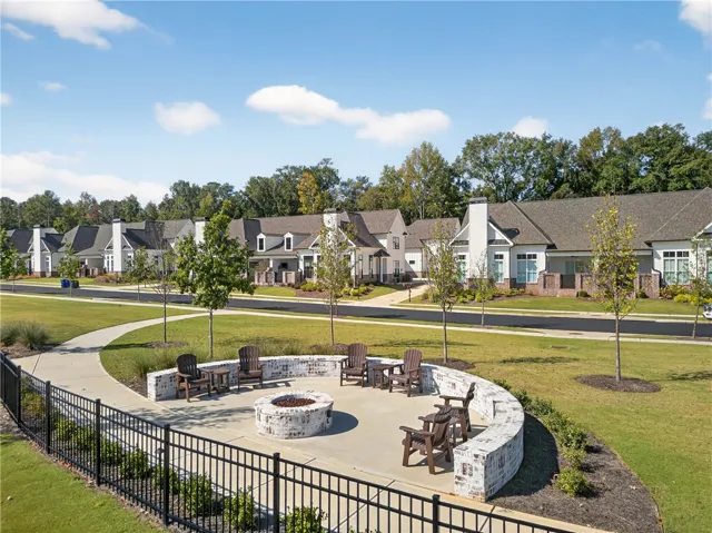 This inviting outdoor space with a fire pit offers a perfect setting for community gatherings.