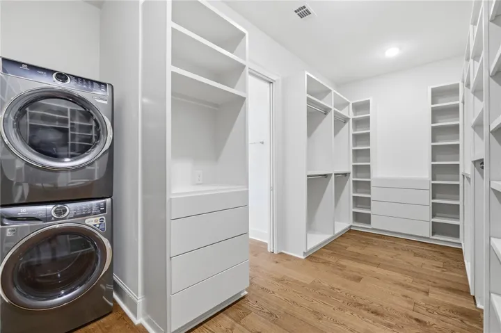 Organized living begins here with built-in shelving and ample storage within this practical closet.
