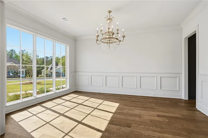 The Formal Dining Room, Adorned with A Beautiful, Crystal Chandelier, Provides an Elegant Backdrop For Special Occasions.