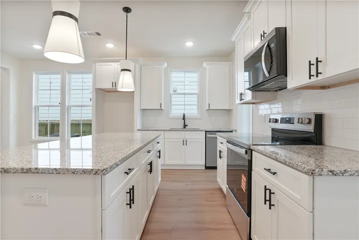 Move in Ready Tate plan on lot 128 by Holland Homes LLC.