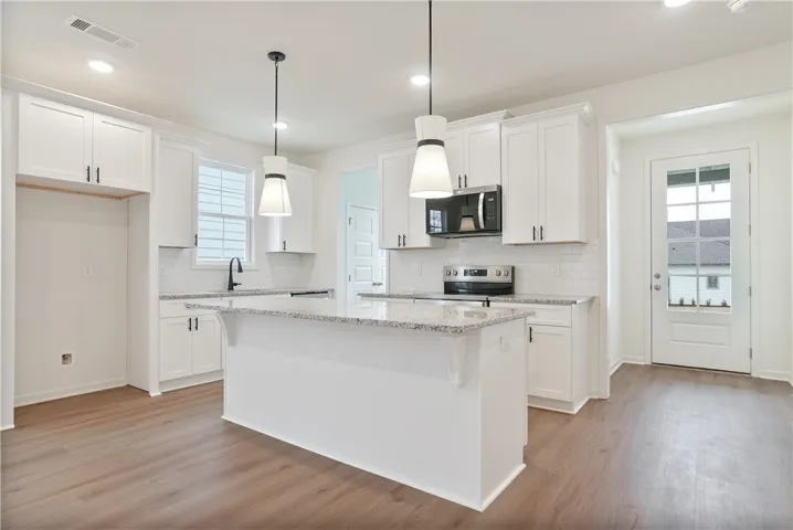 Move in Ready Tate plan on lot 128 by Holland Homes LLC.