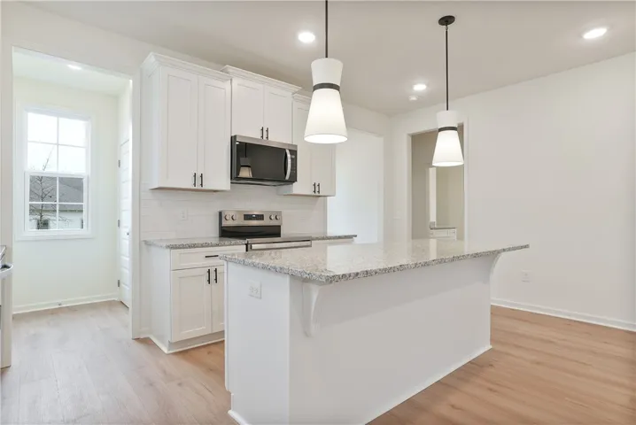 Move in Ready Tate plan on lot 128 by Holland Homes LLC.