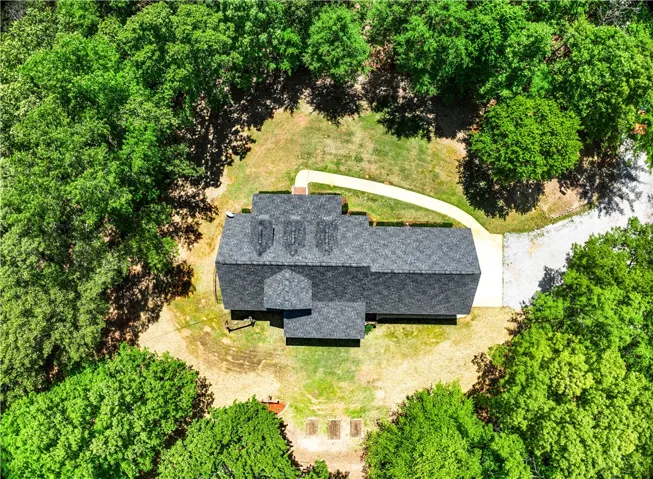 Perched amidst lush greenery, this property offers serene privacy and natural surroundings.