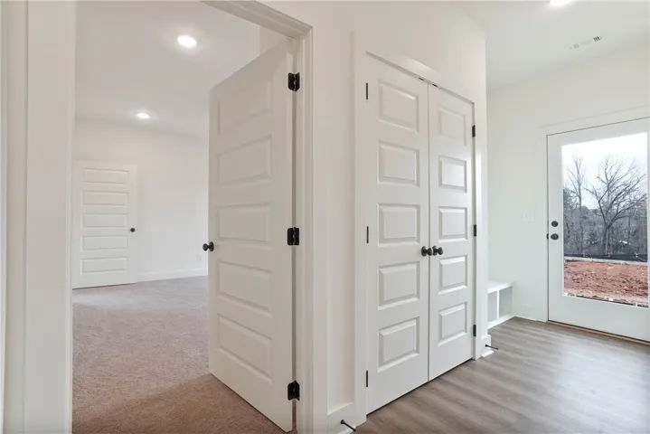 Hall Storage Closet & Mud-Bench by exterior Access to back patio