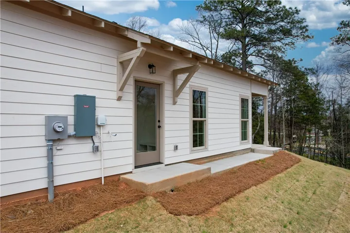 Side Door to Back Yard & walkway to covered Back Patio