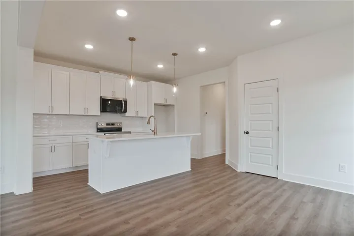 Large Center Island & Soft Close Cabinetry Throughout