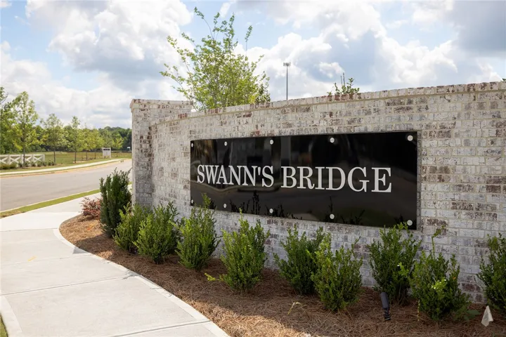 Welcome to Swann's Bridge, a distinguished community with elegant brickwork and lush landscaping.