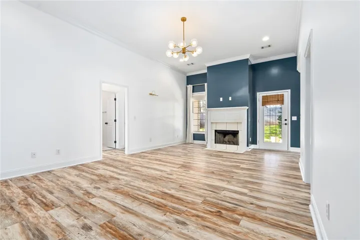 Spacious living room with wood burning fireplace