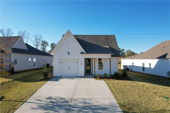 The Trace plan by Holland Homes LLC. This is NOT the subject property, but it is the same plan built on another lot. All plans, pricing, and specifications are subject to change without notice.