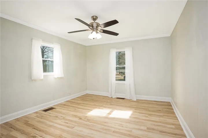 Bedroom 2 with views of the backyard