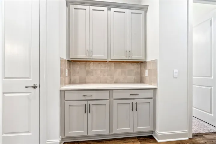 This built-in cabinetry provides ample storage and a refined aesthetic.