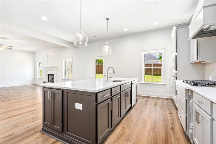 This modern kitchen features a spacious island and bright, open living spaces.