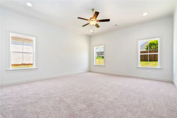 Bright and airy, this room features ample natural light and a comfortable feel.