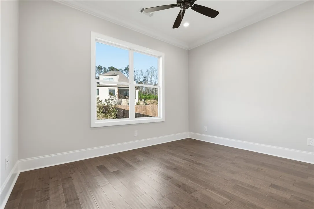 Bedroom 2 features wood floors.