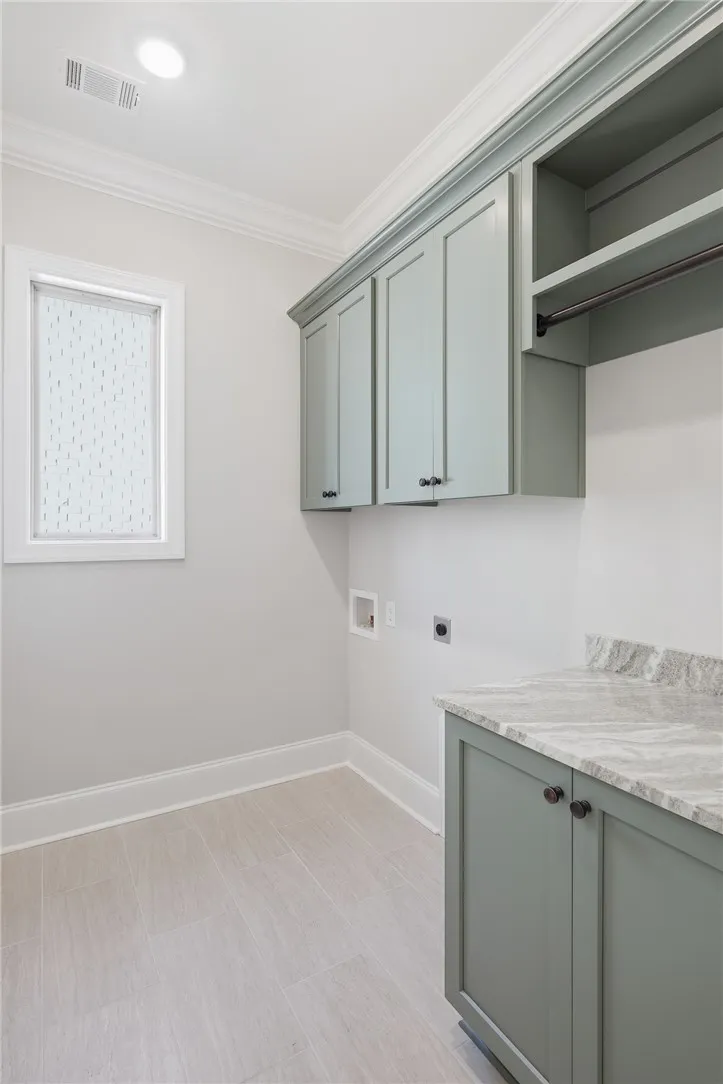 Abundant storage makes the laundry room both functional and attractive.