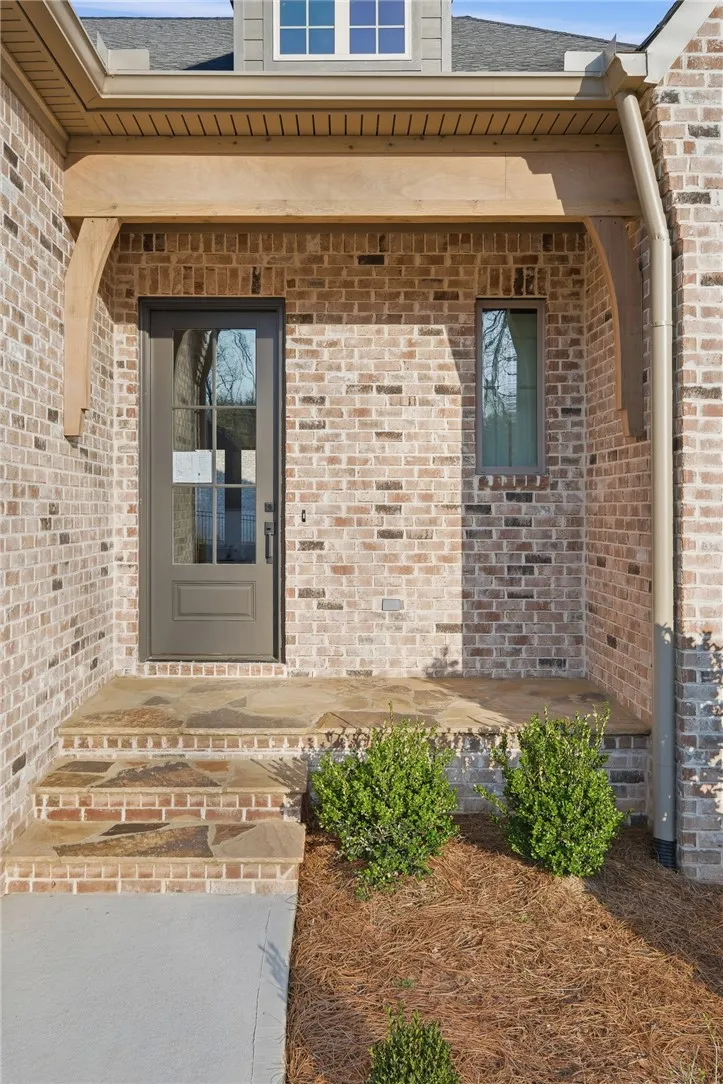 Flagstone and cedar trim accents add character to the front porch.