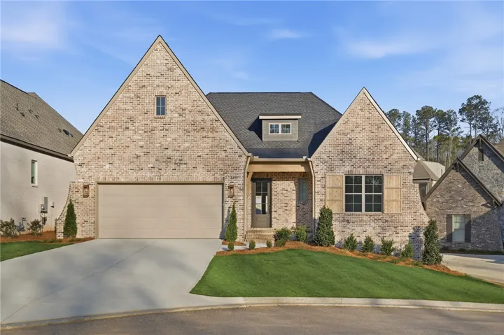 Classic full-brick exterior with cedar accents, and a flagstone front porch.