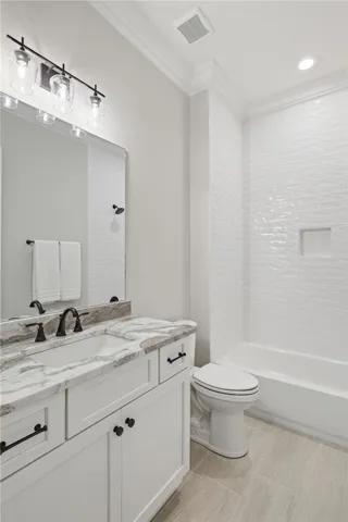 Bath 2: ceiling height-tile, tub/shower surround.