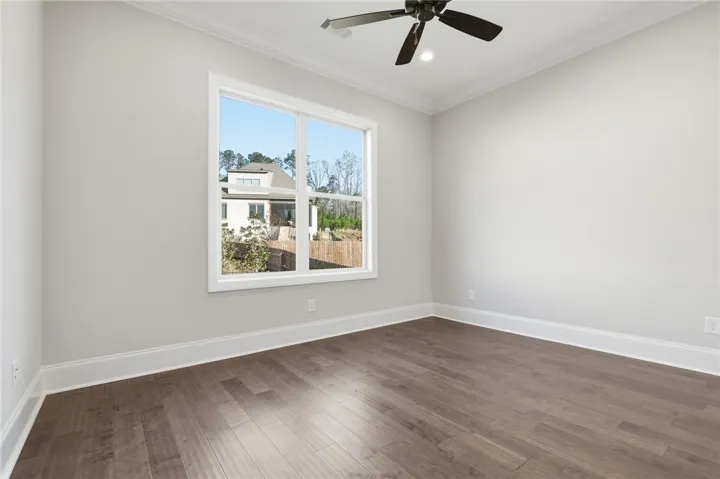 Bedroom 2 features wood floors.
