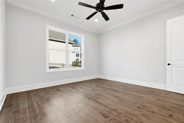 The primary suite is separated from bedrooms 2 and 3 by the living areas.