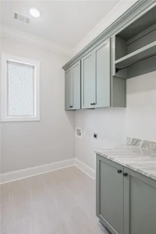 Abundant storage makes the laundry room both functional and attractive.