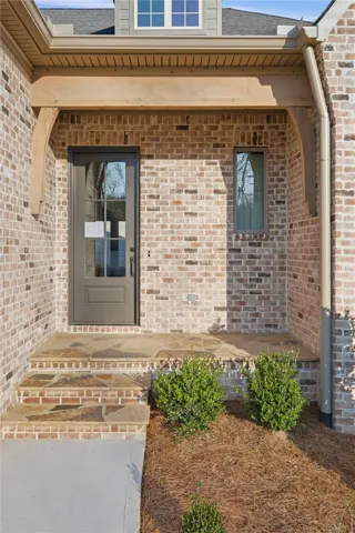 Flagstone and cedar trim accents add character to the front porch.