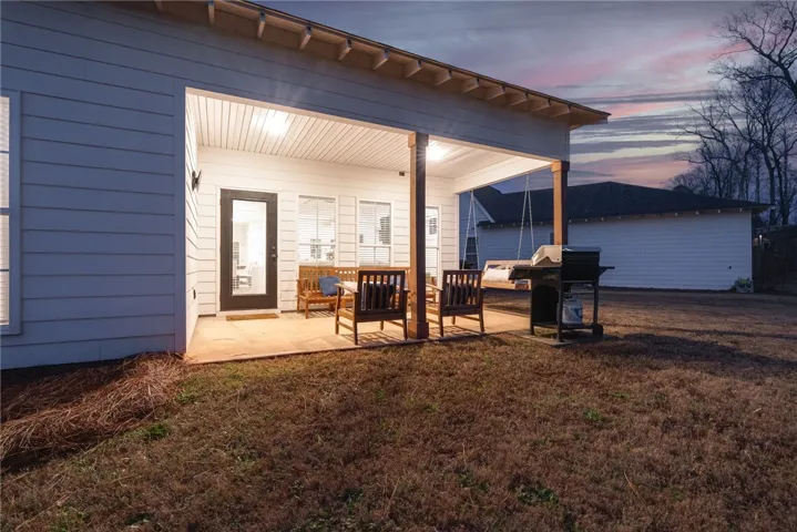 Covered back porch with swing