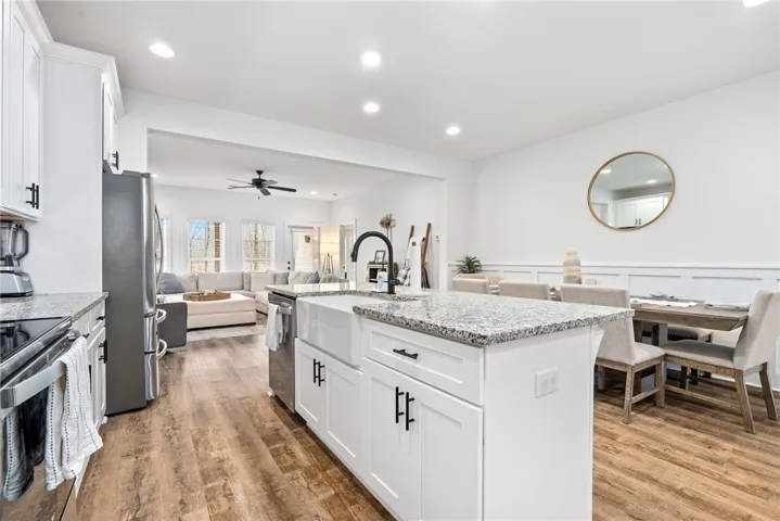 Kitchen features Whirlpool appliances and Delta Plumbing