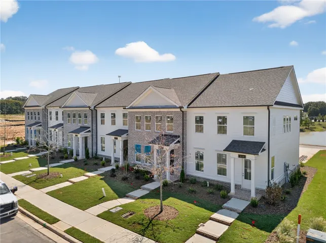Photo not of subject property. Photo of completed building in community for reference