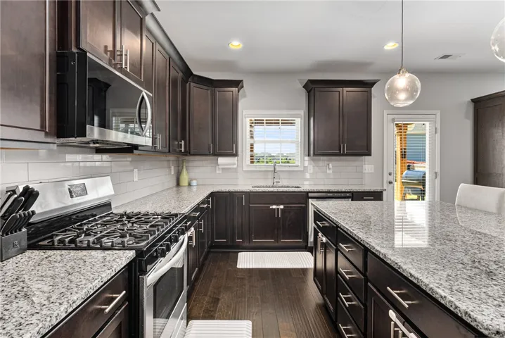 The U-shape design of the kitchen makes it highly functional. Check out the amount of counter space!