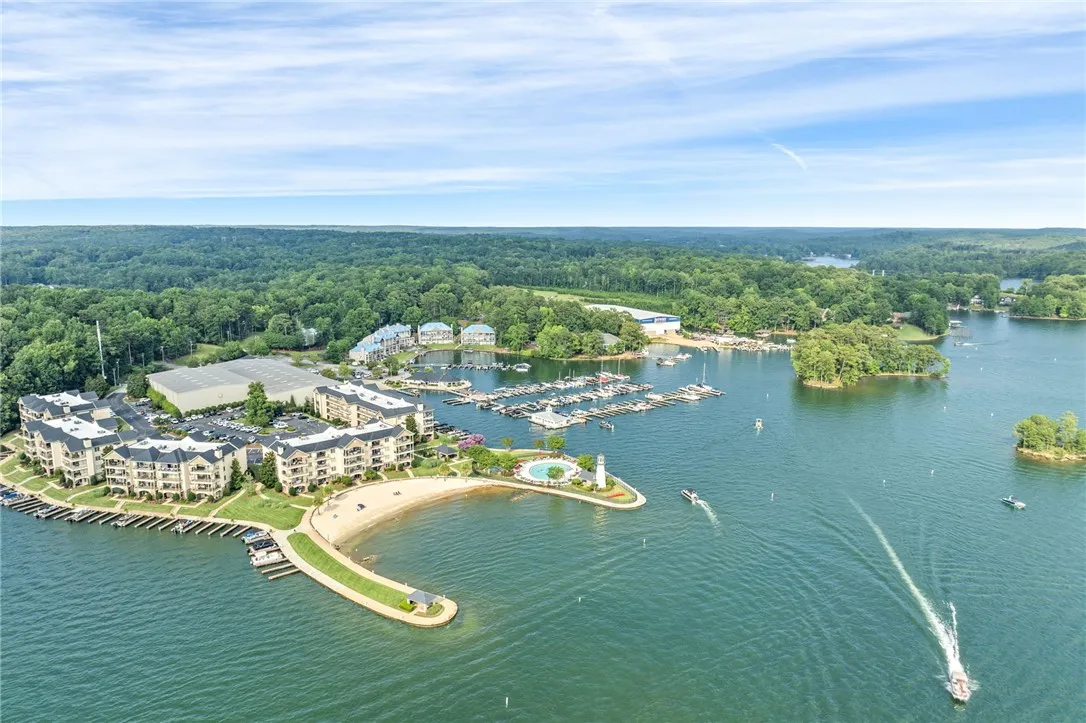Lakeside living offers a private beach, pool, marina, and condominium residences with serene water views.