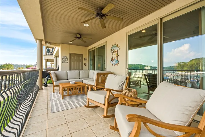 A spacious, tiled balcony offers an idyllic retreat with sweeping marina views.