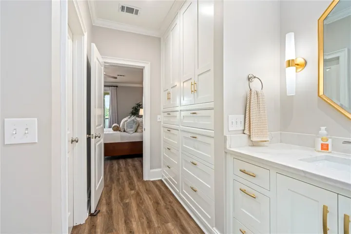 Smart storage solutions and a well-appointed vanity create a functional and stylish space.
