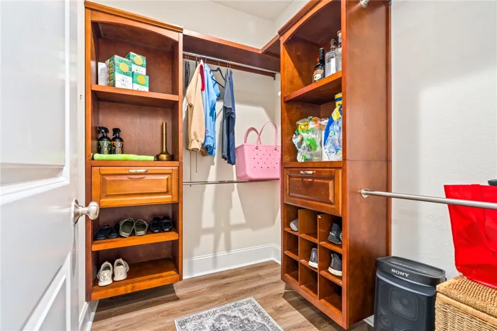 Custom built-ins and ample storage define this organized closet space.