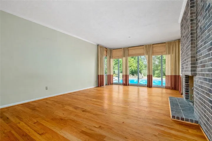 Formal living room with view of pool
