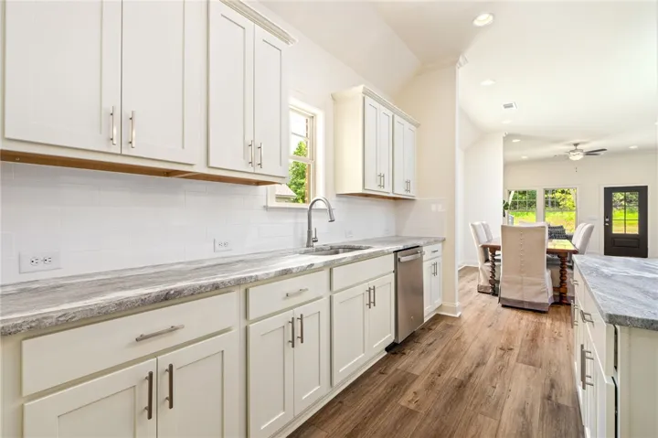 Clean lines define this bright kitchen, complete with ample counter space and modern fixtures.
