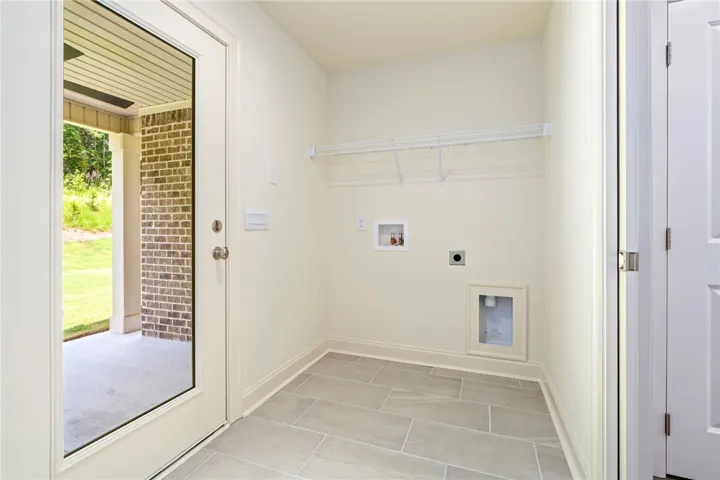 A well-appointed laundry room with convenient outdoor access.