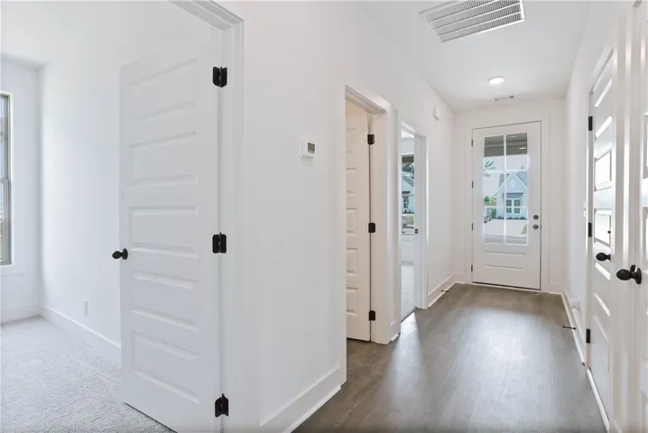 Front hallway with 2 guest bedrooms, full guest bath & storage closet
- All plans, specifications & pricing are subject to change without notice.