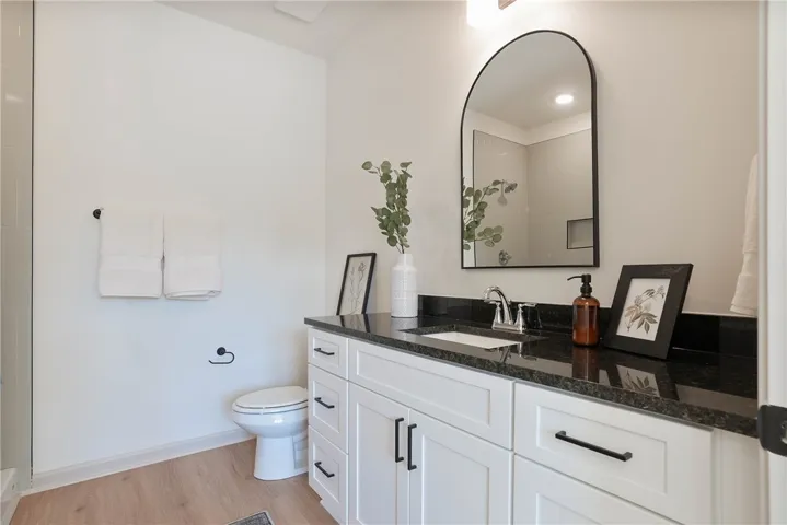 A well-appointed bathroom with a sleek vanity and modern fixtures awaits.