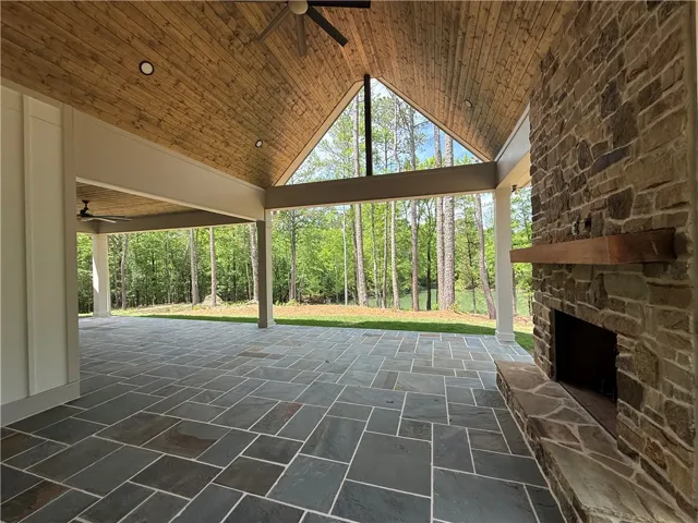 This expansive outdoor patio offers serene views, perfect for peaceful gatherings or quiet reflection.