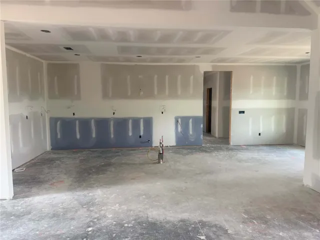 Ready for personalized touches, this unfinished interior awaits a visionary homeowner's design.