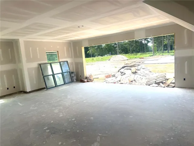 A spacious room under construction awaits finishing touches, offering potential for personalization.