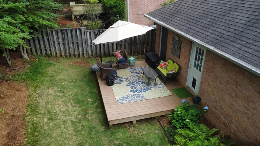 Enjoy outdoor living on this charming patio, perfect for relaxation and gatherings.