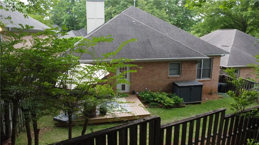 This charming home offers a spacious backyard with a lovely deck for outdoor enjoyment.