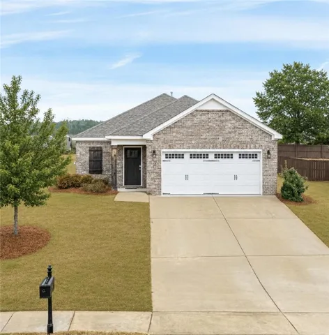 This charming brick residence offers comfortable living and a welcoming presence.