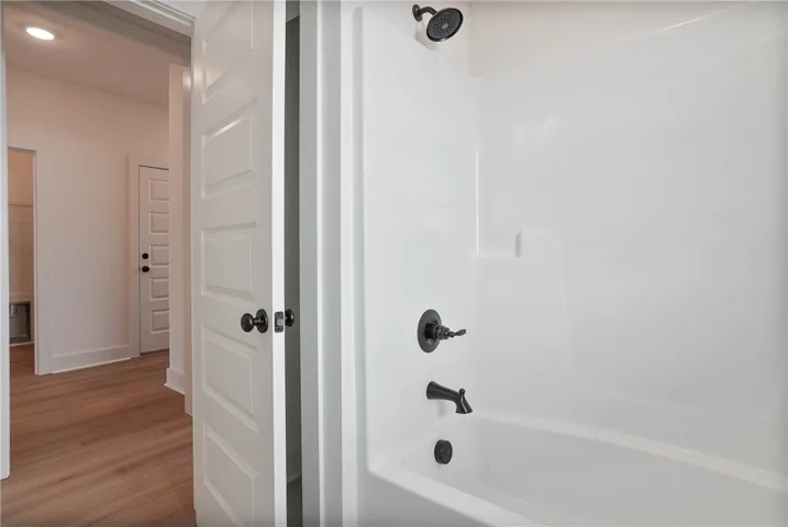 Guest Bathroom right off entry foyer & splitting Bedrooms 2 & 3