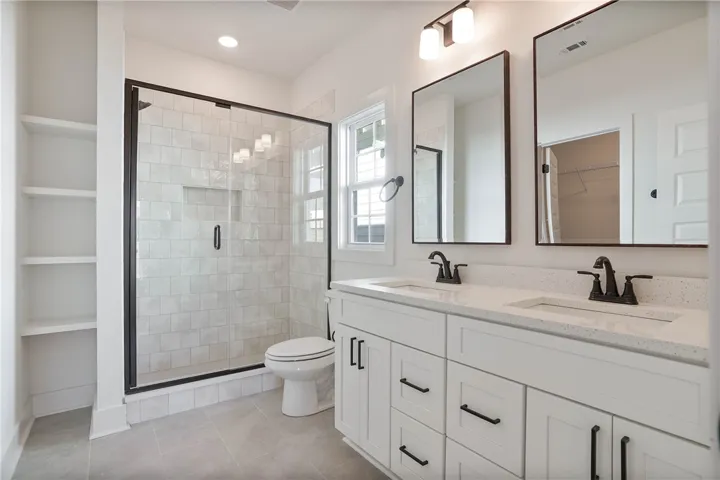 Primary Bathroom - Double Vanity, Walk-In Tile Shower & Shelving for Linen Storage