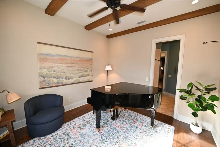 An inviting music space is finished with a vaulted ceiling.